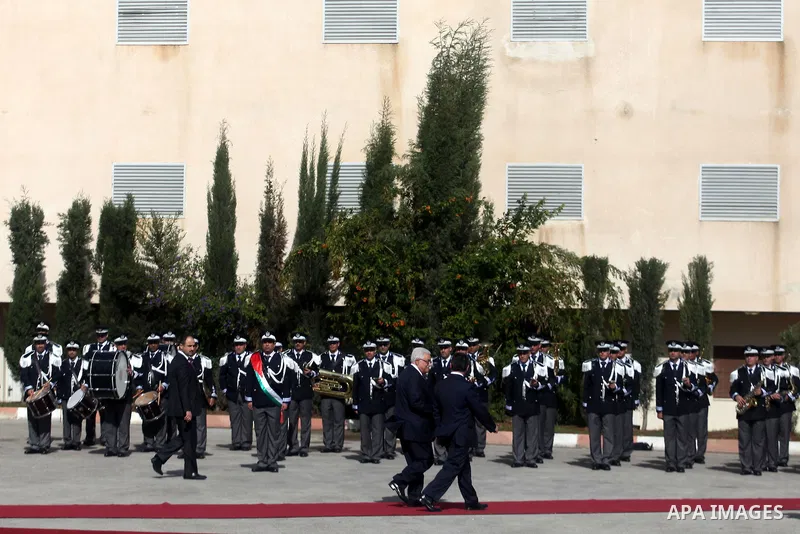 Palestinian president Mahmoud Abbas and Jordanian King Abdullah II review the honour guard during a welcome ceremony upon the latter's arrival in the West Bank city of Ramallah on December 6, 2012. King Abdullah II is th...