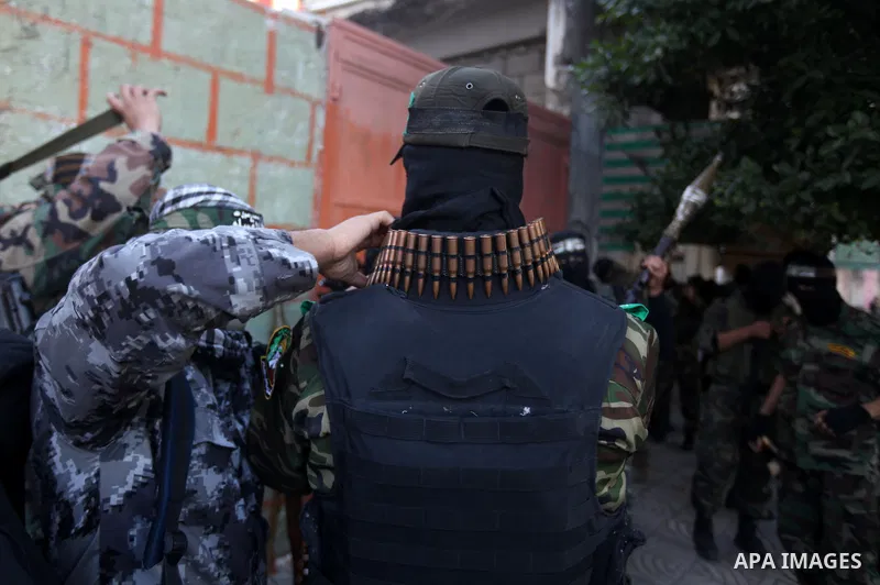 Palestinian militants of the Ezzedine al-Qassam brigade, the armed wing Hamas, attend Friday prayer as they prepare for the arrival of the Islamist movement's exiled politburo chief Khaled Meshaal who is due in the Gaza...