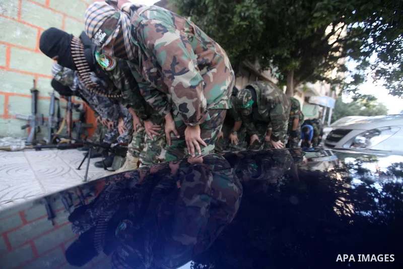 Palestinian militants of the Ezzedine al-Qassam brigade, the armed wing Hamas, attend Friday prayer as they prepare for the arrival of the Islamist movement's exiled politburo chief Khaled Meshaal who is due in the Gaza...