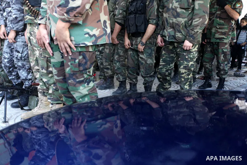 Palestinian militants of the Ezzedine al-Qassam brigade, the armed wing Hamas, attend Friday prayer as they prepare for the arrival of the Islamist movement's exiled politburo chief Khaled Meshaal who is due in the Gaza...