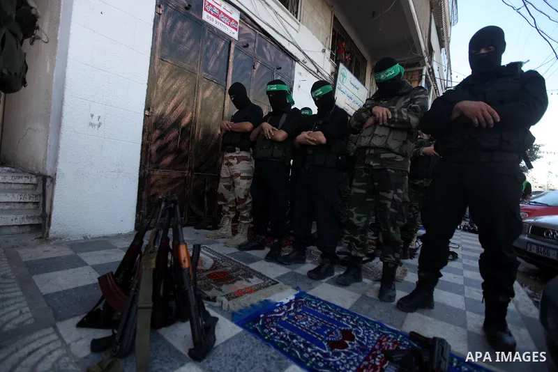 Palestinian militants of the Ezzedine al-Qassam brigade, the armed wing Hamas, attend Friday prayer as they prepare for the arrival of the Islamist movement's exiled politburo chief Khaled Meshaal who is due in the Gaza...