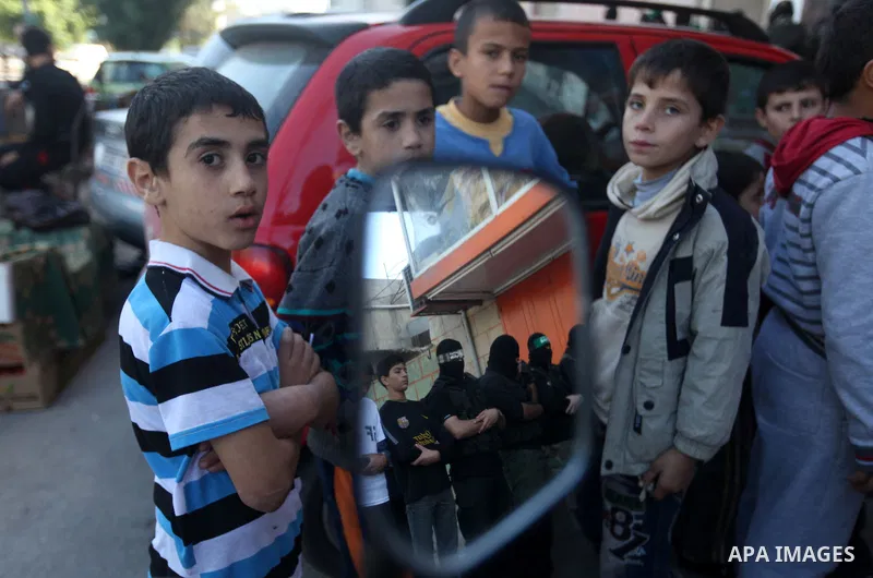 Palestinian militants of the Ezzedine al-Qassam brigade, the armed wing Hamas, attend Friday prayer as they prepare for the arrival of the Islamist movement's exiled politburo chief Khaled Meshaal who is due in the Gaza...