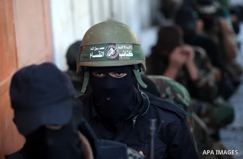 Palestinian militants of the Ezzedine al-Qassam brigade, the armed wing Hamas, attend Friday prayer as they prepare for the arrival of the Islamist movement's exiled politburo chief Khaled Meshaal who is due in the Gaza...