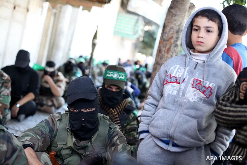 Palestinian militants of the Ezzedine al-Qassam brigade, the armed wing Hamas, attend Friday prayer as they prepare for the arrival of the Islamist movement's exiled politburo chief Khaled Meshaal who is due in the Gaza...