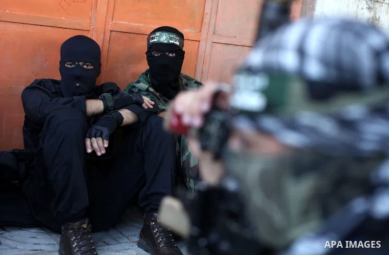 Palestinian militants of the Ezzedine al-Qassam brigade, the armed wing Hamas, attend Friday prayer as they prepare for the arrival of the Islamist movement's exiled politburo chief Khaled Meshaal who is due in the Gaza...