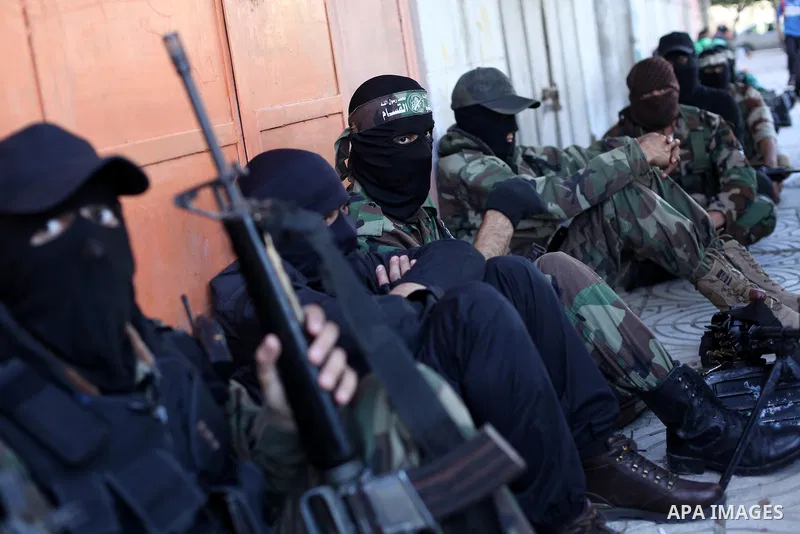 Palestinian militants of the Ezzedine al-Qassam brigade, the armed wing Hamas, attend Friday prayer as they prepare for the arrival of the Islamist movement's exiled politburo chief Khaled Meshaal who is due in the Gaza...