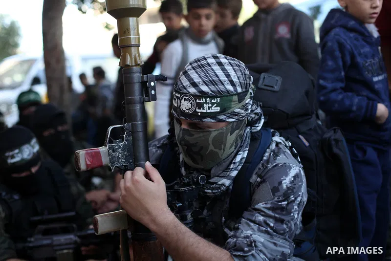 Palestinian militants of the Ezzedine al-Qassam brigade, the armed wing Hamas, attend Friday prayer as they prepare for the arrival of the Islamist movement's exiled politburo chief Khaled Meshaal who is due in the Gaza...