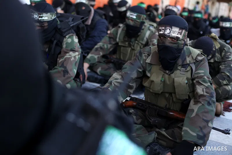 Palestinian militants of the Ezzedine al-Qassam brigade, the armed wing Hamas, attend Friday prayer as they prepare for the arrival of the Islamist movement's exiled politburo chief Khaled Meshaal who is due in the Gaza...