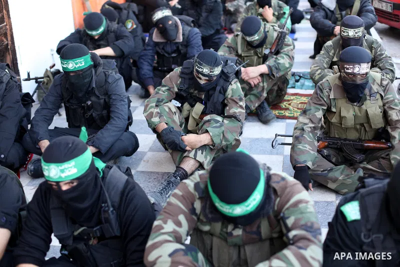 Palestinian militants of the Ezzedine al-Qassam brigade, the armed wing Hamas, attend Friday prayer as they prepare for the arrival of the Islamist movement's exiled politburo chief Khaled Meshaal who is due in the Gaza...