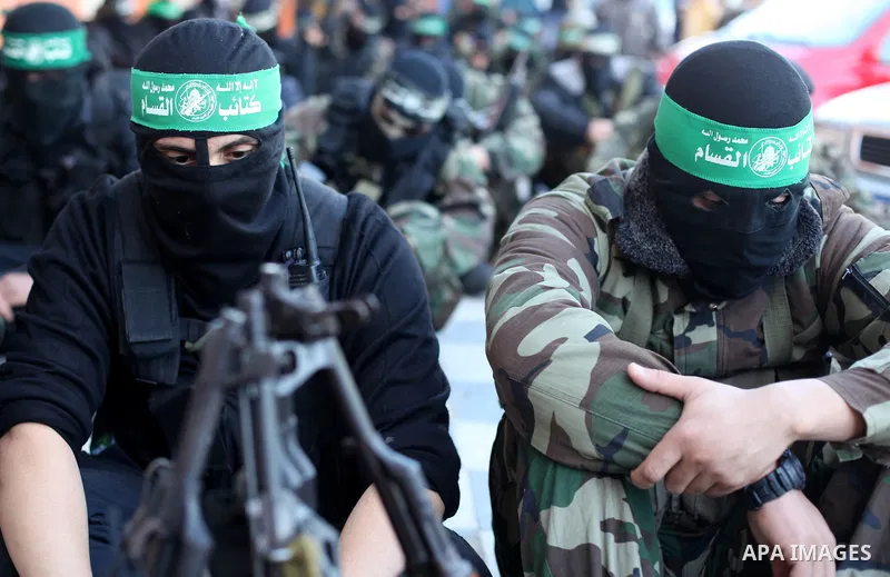 Palestinian militants of the Ezzedine al-Qassam brigade, the armed wing Hamas, attend Friday prayer as they prepare for the arrival of the Islamist movement's exiled politburo chief Khaled Meshaal who is due in the Gaza...
