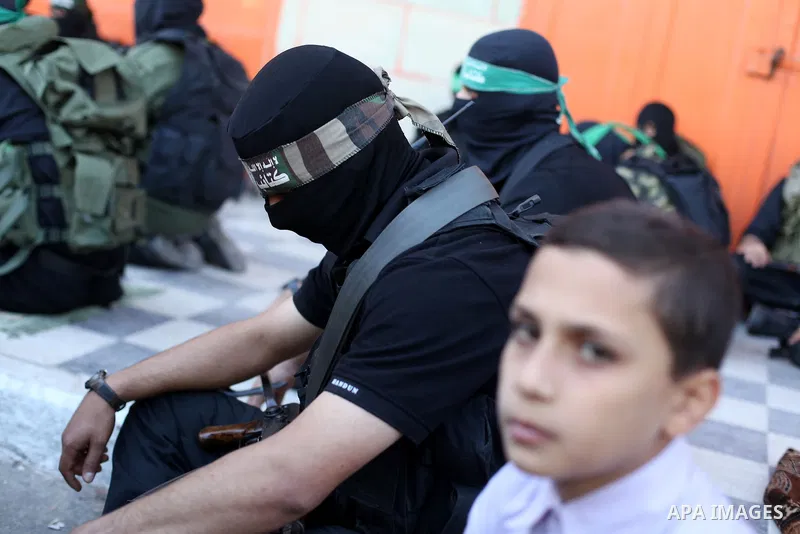 Palestinian militants of the Ezzedine al-Qassam brigade, the armed wing Hamas, attend Friday prayer as they prepare for the arrival of the Islamist movement's exiled politburo chief Khaled Meshaal who is due in the Gaza...