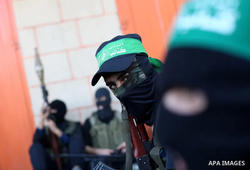 Palestinian militants of the Ezzedine al-Qassam brigade, the armed wing Hamas, attend Friday prayer as they prepare for the arrival of the Islamist movement's exiled politburo chief Khaled Meshaal who is due in the Gaza...