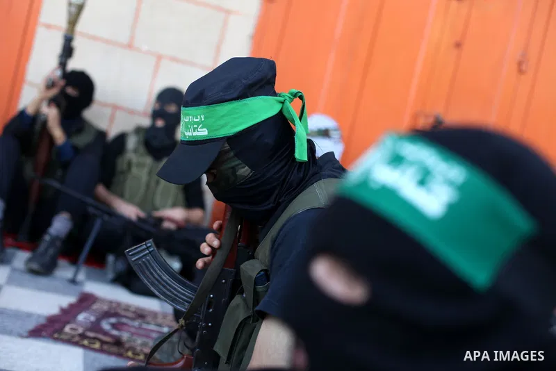 Palestinian militants of the Ezzedine al-Qassam brigade, the armed wing Hamas, attend Friday prayer as they prepare for the arrival of the Islamist movement's exiled politburo chief Khaled Meshaal who is due in the Gaza...