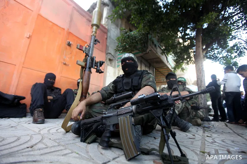 Palestinian militants of the Ezzedine al-Qassam brigade, the armed wing Hamas, attend Friday prayer as they prepare for the arrival of the Islamist movement's exiled politburo chief Khaled Meshaal who is due in the Gaza...