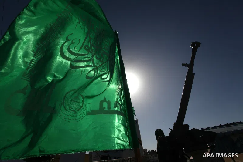 A Palestinian militant of the Ezzedine al-Qassam brigade, the armed wing Hamas, stands guard as they prepare for the arrival of the Islamist movement's exiled politburo chief Khaled Meshaal who is due in the Gaza Strip t...