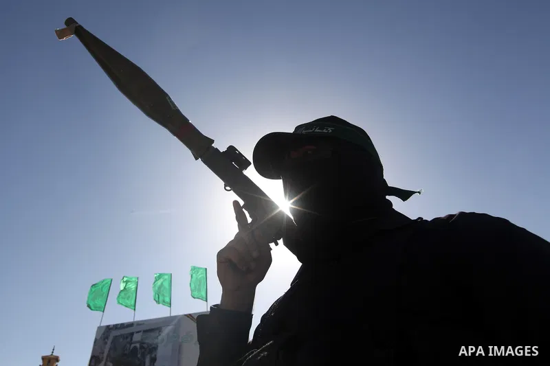 A Palestinian militant of the Ezzedine al-Qassam brigade, the armed wing Hamas, stands guard as they prepare for the arrival of the Islamist movement's exiled politburo chief Khaled Meshaal who is due in the Gaza Strip t...