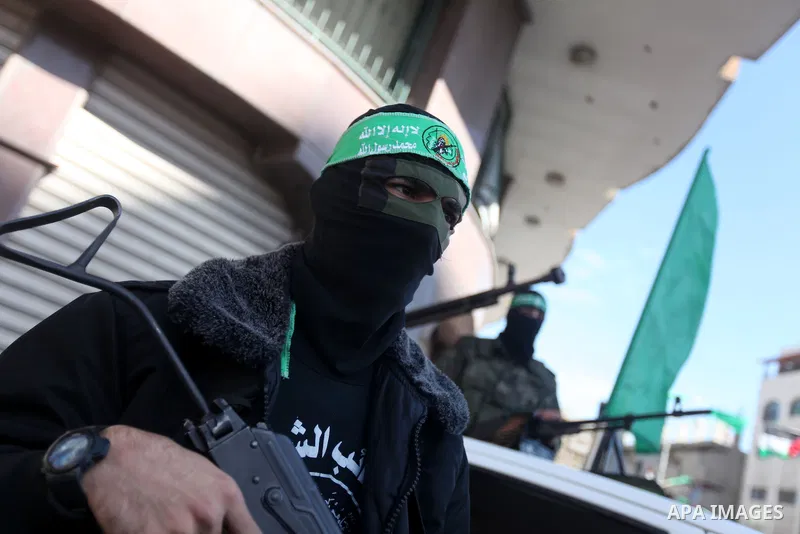Palestinian militants of the Ezzedine al-Qassam brigade, the armed wing Hamas, stand guard as they prepare for the arrival of the Islamist movement's exiled politburo chief Khaled Meshaal who is due in the Gaza Strip to...