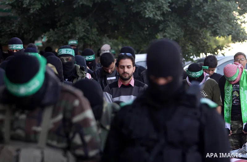 Palestinian militants of the Ezzedine al-Qassam brigade, the armed wing Hamas, attend Friday prayer as they prepare for the arrival of the Islamist movement's exiled politburo chief Khaled Meshaal who is due in the Gaza...