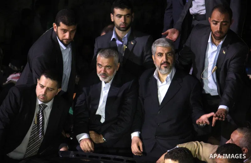 Hamas leader Khaled Meshaal visits the home of the al-Dallu family, which destroyed by an Israeli airstrike on November 24 and several members of the al-Dallu family - five of them children - and two of their neighbours...