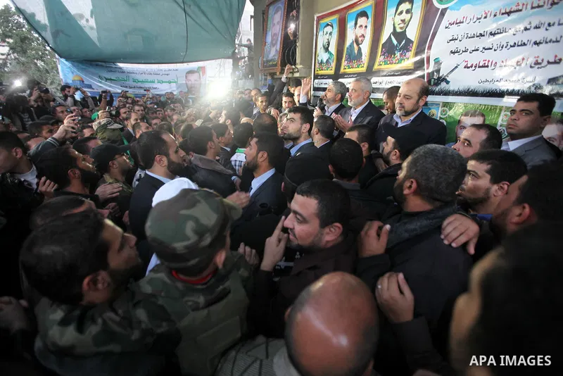 Hamas leader Khaled Meshaal visits the home of the late Hamas military commander Ahmed Al-Jaabari, who was killed in an Israeli air strike, in Gaza city on December 7, 2012. Meshaal is making his first-ever visit to the...