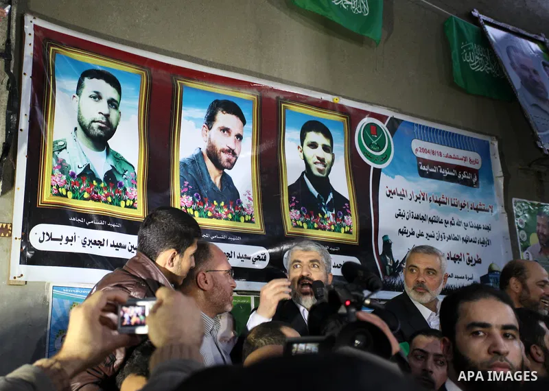 Hamas leader Khaled Meshaal visits the home of the late Hamas military commander Ahmed Al-Jaabari, who was killed in an Israeli air strike, in Gaza city on December 7, 2012. Meshaal is making his first-ever visit to the...