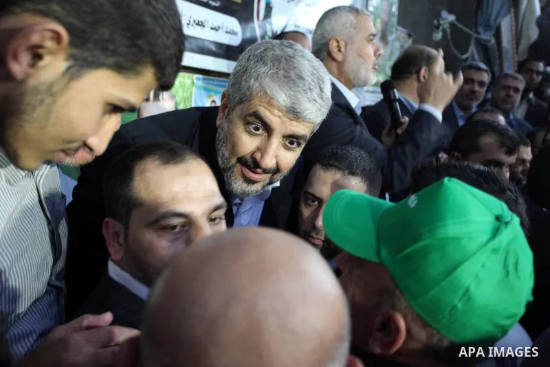 Hamas leader Khaled Meshaal visits the home of the late Hamas military commander Ahmed Al-Jaabari, who was killed in an Israeli air strike, in Gaza city on December 7, 2012. Meshaal is making his first-ever visit to the...