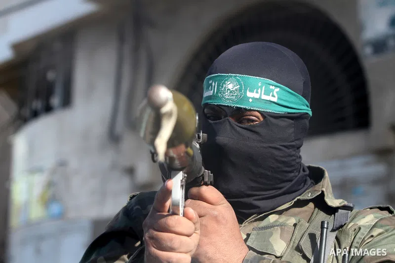 A Palestinian militant of the Ezzedine al-Qassam brigade, the armed wing Hamas, stands guard as they prepare for the arrival of the Islamist movement's exiled politburo chief Khaled Meshaal who is due in the Gaza Strip t...