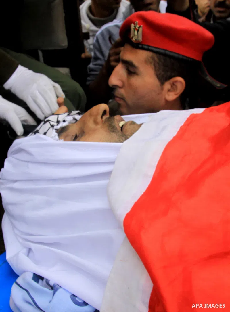 Palestinian security forces carry the body of 37-year-old Hatem Shadid, who was shot dead by members of the Israeli internal security agency after ramming their car and attacking them with an axe in the West Bank area of...