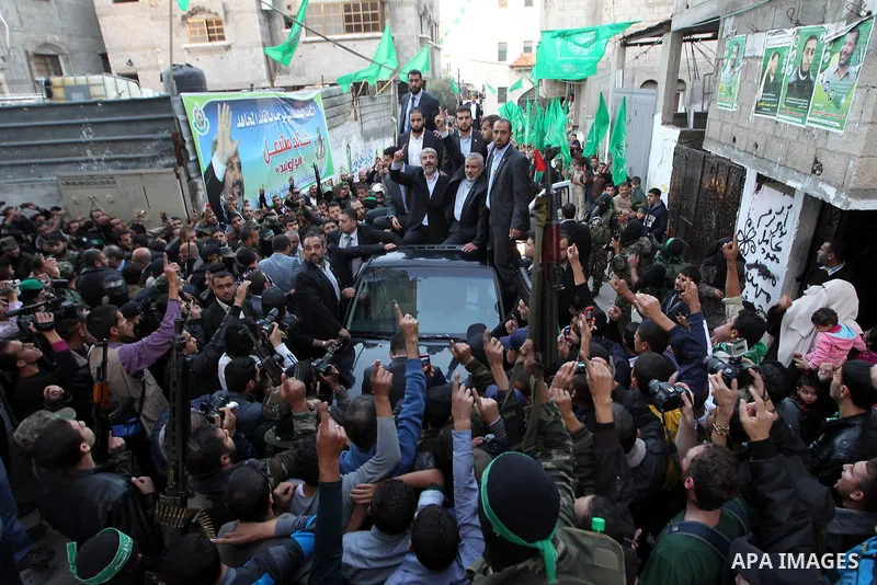Hamas chief Khaled Meshaal, riding in a car with Palestinian prime minister in Gaza Strip Ismail Haniyeh, during a visit to the house of Ahmed Jaabari, the late leader of the Hamas armed wing who was killed in an Israeli...