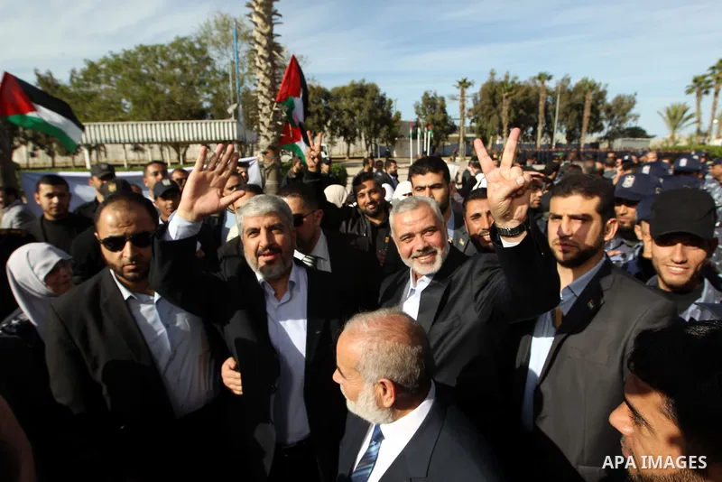 Hamas prime minister Ismail Haniya shows Haniya greeting Palestinian Hamas leader in exile Khaled Meshaal upon the latter's arrival in the Gaza Strip from the Rafah border crossing on December 7, 2012. Meshaal made his f...