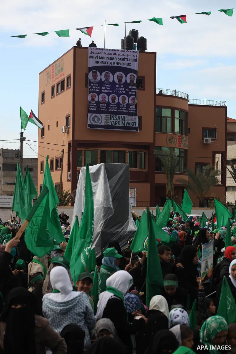 Palestinian Hamas supporters gather to attend a Hamas rally marking the 25th anniversary of the Islamist movement's founding in Gaza City on December 8, 2012. Hamas chief Khaled Meshaal arrived to Gaza strip on December...