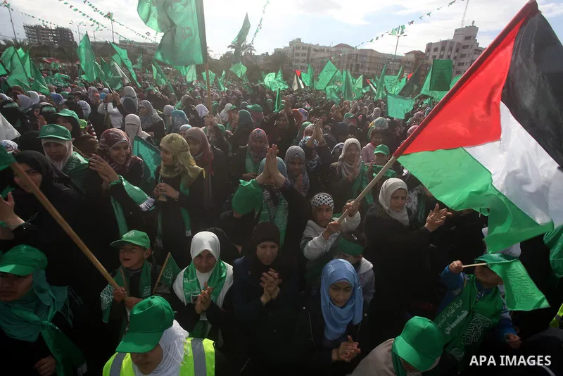 Palestinian Hamas supporters gather to attend a Hamas rally marking the 25th anniversary of the Islamist movement's founding in Gaza City on December 8, 2012. Hamas chief Khaled Meshaal arrived to Gaza strip on December...