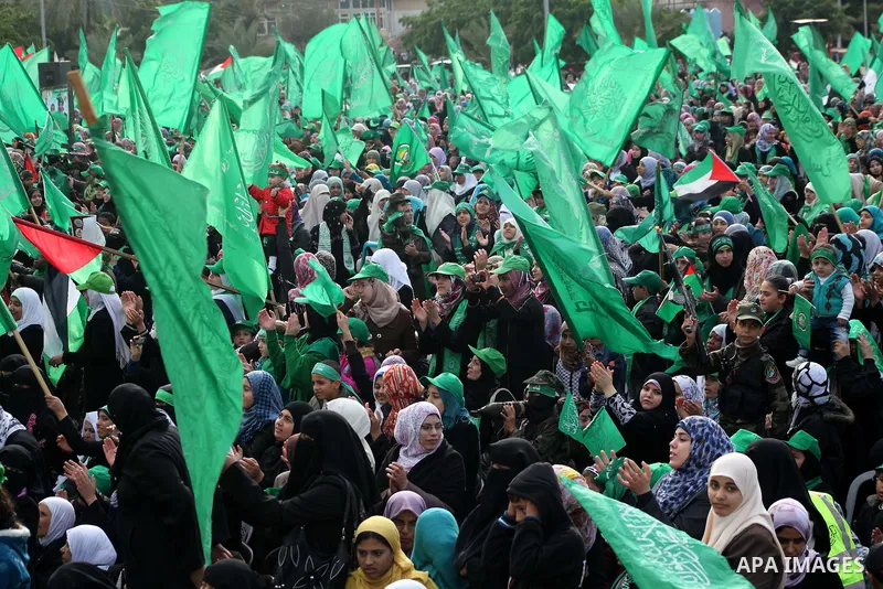 Palestinian Hamas supporters gather to attend a Hamas rally marking the 25th anniversary of the Islamist movement's founding in Gaza City on December 8, 2012. Hamas chief Khaled Meshaal arrived to Gaza strip on December...