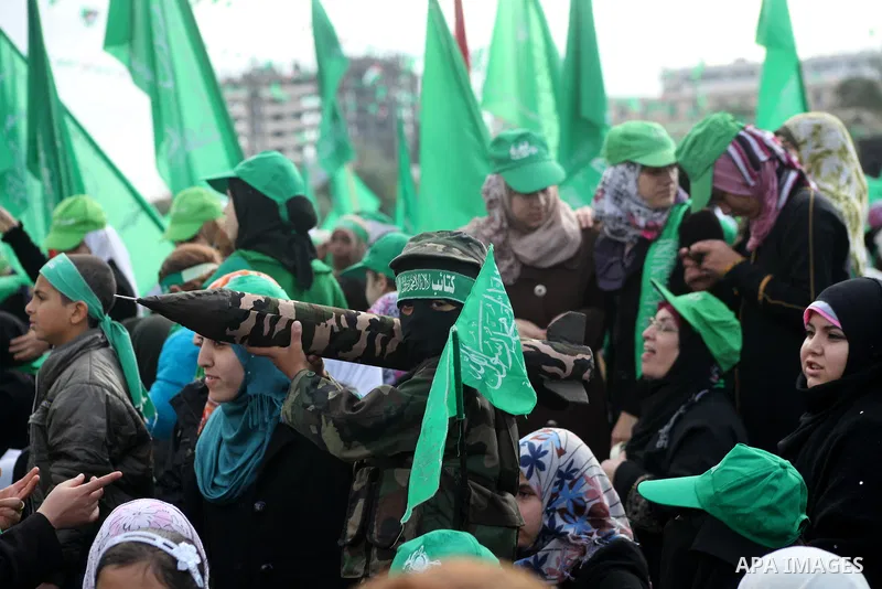 Palestinian Hamas supporters gather to attend a Hamas rally marking the 25th anniversary of the Islamist movement's founding in Gaza City on December 8, 2012. Hamas chief Khaled Meshaal arrived to Gaza strip on December...