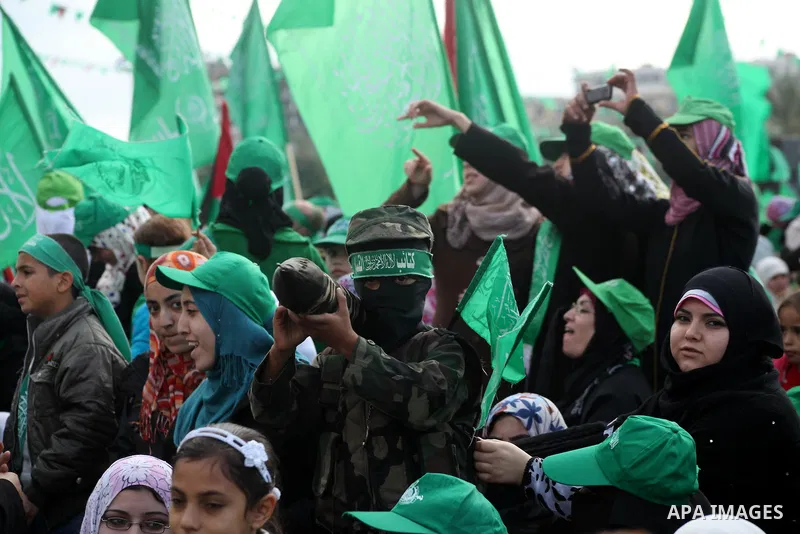Palestinian Hamas supporters gather to attend a Hamas rally marking the 25th anniversary of the Islamist movement's founding in Gaza City on December 8, 2012. Hamas chief Khaled Meshaal arrived to Gaza strip on December...