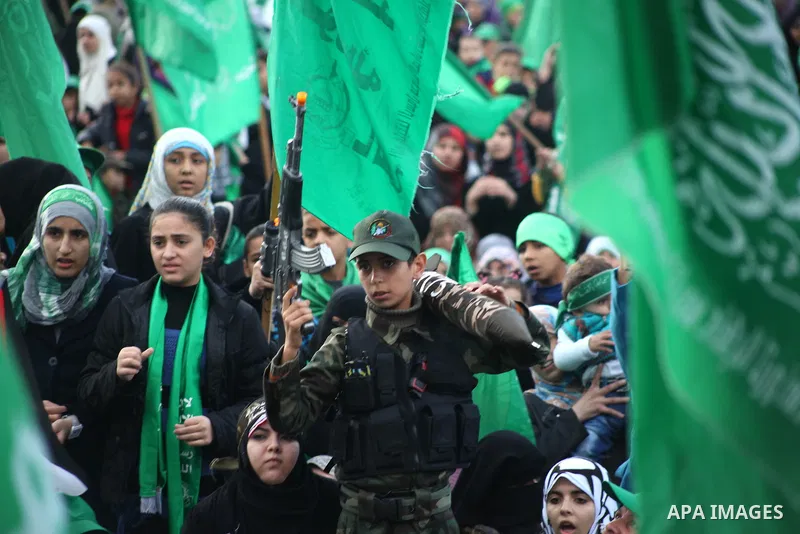 Palestinian Hamas supporters gather to attend a Hamas rally marking the 25th anniversary of the Islamist movement's founding in Gaza City on December 8, 2012. Hamas chief Khaled Meshaal arrived to Gaza strip on December...