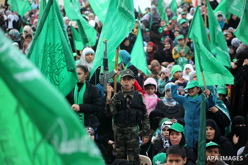 Palestinian Hamas supporters gather to attend a Hamas rally marking the 25th anniversary of the Islamist movement's founding in Gaza City on December 8, 2012. Hamas chief Khaled Meshaal arrived to Gaza strip on December...