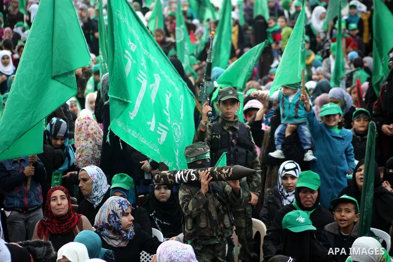 Palestinian Hamas supporters gather to attend a Hamas rally marking the 25th anniversary of the Islamist movement's founding in Gaza City on December 8, 2012. Hamas chief Khaled Meshaal arrived to Gaza strip on December...