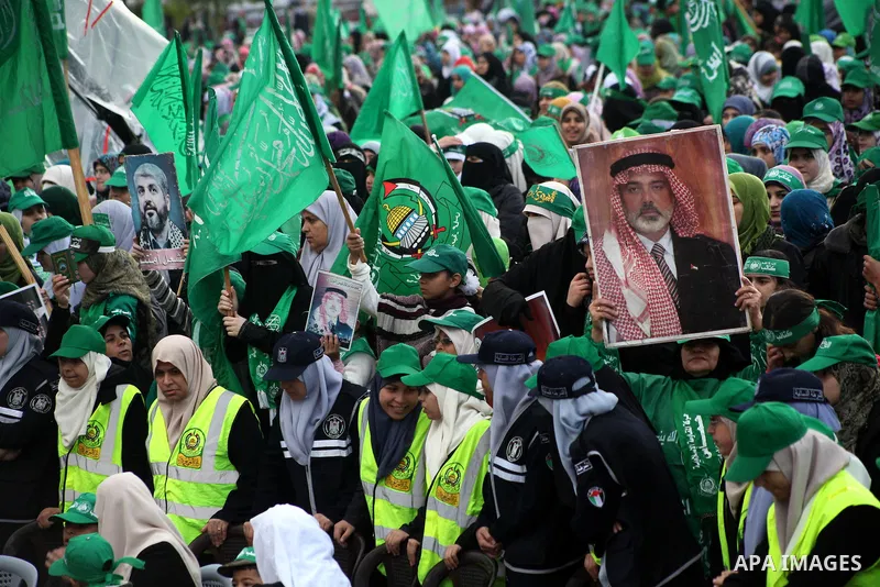 Palestinian Hamas supporters gather to attend a Hamas rally marking the 25th anniversary of the Islamist movement's founding in Gaza City on December 8, 2012. Hamas chief Khaled Meshaal arrived to Gaza strip on December...