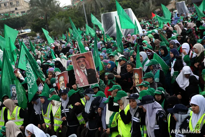 Palestinian Hamas supporters gather to attend a Hamas rally marking the 25th anniversary of the Islamist movement's founding in Gaza City on December 8, 2012. Hamas chief Khaled Meshaal arrived to Gaza strip on December...