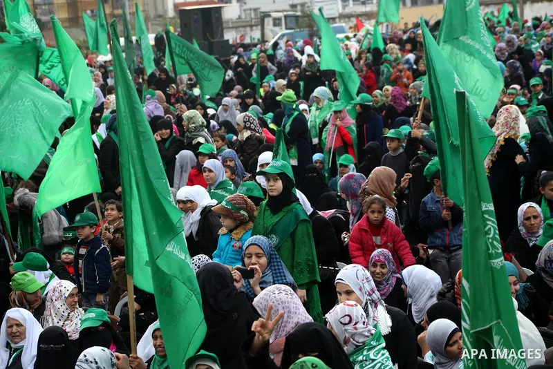 Palestinian Hamas supporters gather to attend a Hamas rally marking the 25th anniversary of the Islamist movement's founding in Gaza City on December 8, 2012. Hamas chief Khaled Meshaal arrived to Gaza strip on December...