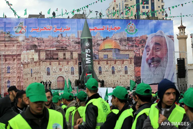 Palestinian Hamas supporters gather to attend a Hamas rally marking the 25th anniversary of the Islamist movement's founding in Gaza City on December 8, 2012. Hamas chief Khaled Meshaal arrived to Gaza strip on December...