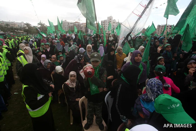Palestinian Hamas supporters gather to attend a Hamas rally marking the 25th anniversary of the Islamist movement's founding in Gaza City on December 8, 2012. Hamas chief Khaled Meshaal arrived to Gaza strip on December...