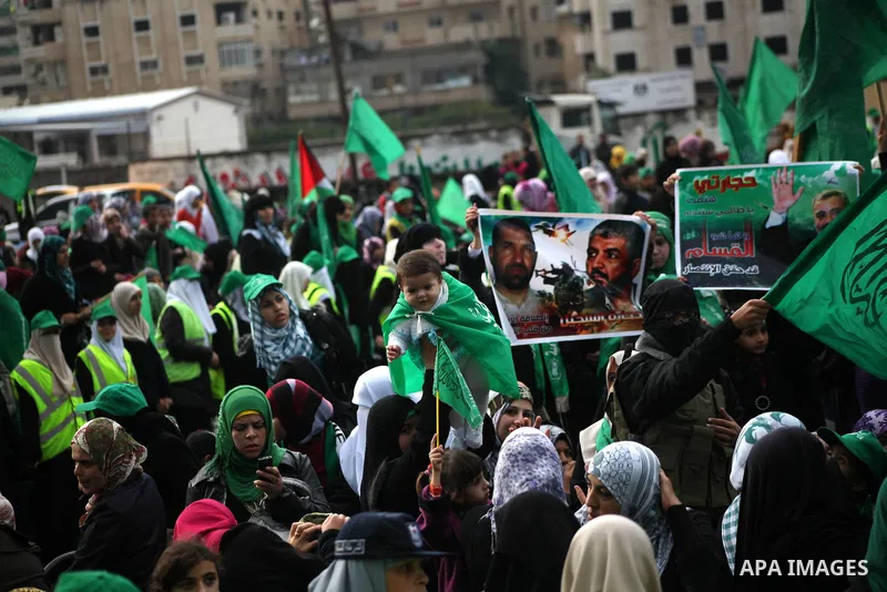 Palestinian Hamas supporters gather to attend a Hamas rally marking the 25th anniversary of the Islamist movement's founding in Gaza City on December 8, 2012. Hamas chief Khaled Meshaal arrived to Gaza strip on December...