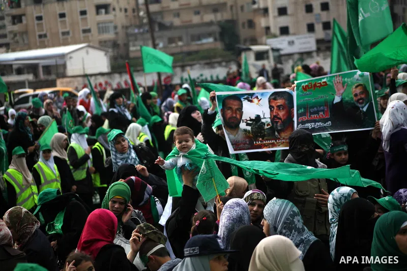 Palestinian Hamas supporters gather to attend a Hamas rally marking the 25th anniversary of the Islamist movement's founding in Gaza City on December 8, 2012. Hamas chief Khaled Meshaal arrived to Gaza strip on December...