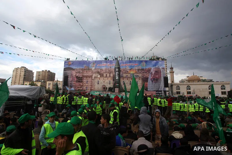 Palestinian Hamas supporters gather to attend a Hamas rally marking the 25th anniversary of the Islamist movement's founding in Gaza City on December 8, 2012. Hamas chief Khaled Meshaal arrived to Gaza strip on December...