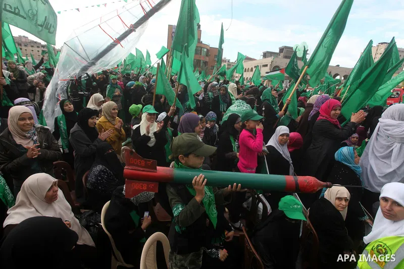 Palestinian Hamas supporters gather to attend a Hamas rally marking the 25th anniversary of the Islamist movement's founding in Gaza City on December 8, 2012. Hamas chief Khaled Meshaal arrived to Gaza strip on December...