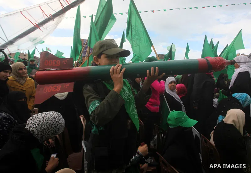 Palestinian Hamas supporters gather to attend a Hamas rally marking the 25th anniversary of the Islamist movement's founding in Gaza City on December 8, 2012. Hamas chief Khaled Meshaal arrived to Gaza strip on December...