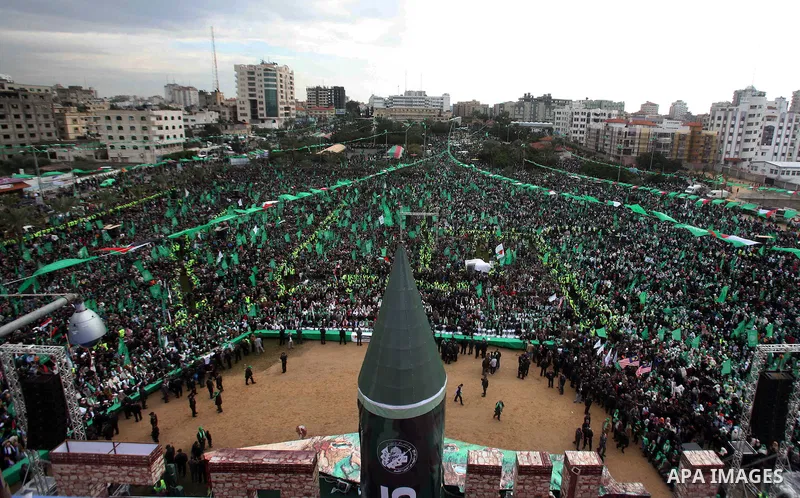 Palestinian Hamas supporters gather to attend a Hamas rally marking the 25th anniversary of the Islamist movement's founding in Gaza City on December 8, 2012. Hamas chief Khaled Meshaal arrived to Gaza strip on December...