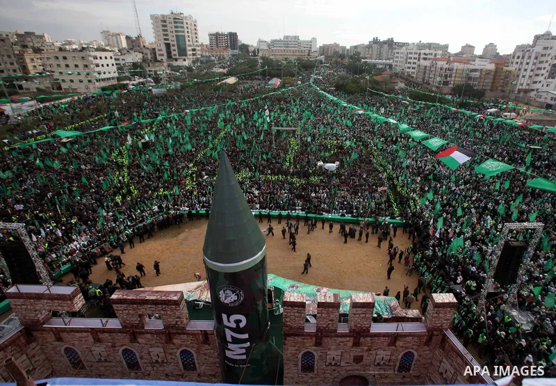 Palestinian Hamas supporters gather to attend a Hamas rally marking the 25th anniversary of the Islamist movement's founding in Gaza City on December 8, 2012. Hamas chief Khaled Meshaal arrived to Gaza strip on December...